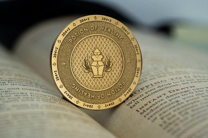 Potion of healing brass coin on a dungeons and dragons players handbook